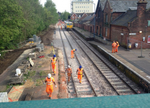 Workers at Beccles station along the newly installed loop