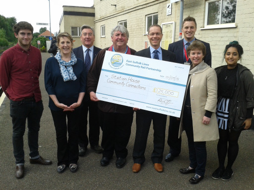 Leader of Suffolk Coastal District Council Ray Herring, The East Suffolk Lines Community Rail Partnership Chairman Aaron Taffera, and Abellio Greater Anglia stakeholder manager Paul Oxley present the members of Station House Community Connections, Bob Webb, Rosamund Web, Jenny Labbett, Oliver Webb, and Jarin Alam with a £25,000 cheque to restore the canopy at Wickham Market railway station.