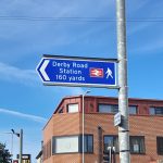 The new double sided sign point to Derby Road station at Foxhall Road
